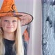 Laughing Happy Blonde Girl in Witch Costume Preparing for Halloween at Home - VideoHive Item for Sale