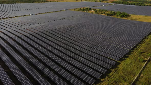 Drone Flying Over A Solar Farm With Several Arrays Of Solar Panels In Vietnam. - Drone Orbit Shot alt