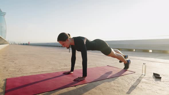 Female Athlete Doing Side Plank in Morning alt