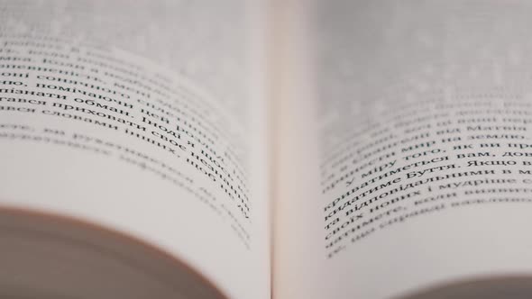 Turning Pages of a Book CloseUp Slow Motion alt