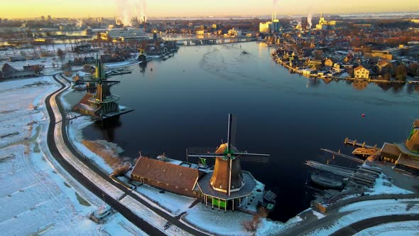 Wooden Wind Mill at the Zaanse Schans Windmill Village During Winter with Snowy Landscape Snow alt