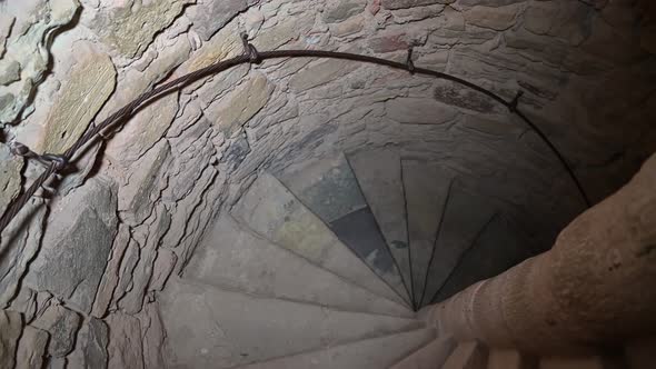 An entrance to the dungeon. An ancient stone spiral staircase.