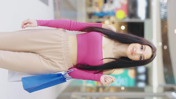 Vertical Screen Slow Motion Woman Walking in Shopping Center alt