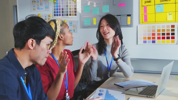 brainstorming about mobile app interface workflow design on table with coworker breif alt