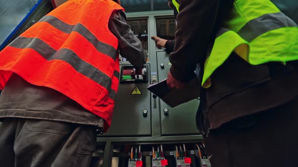Engineers Checking the Electrical Box alt