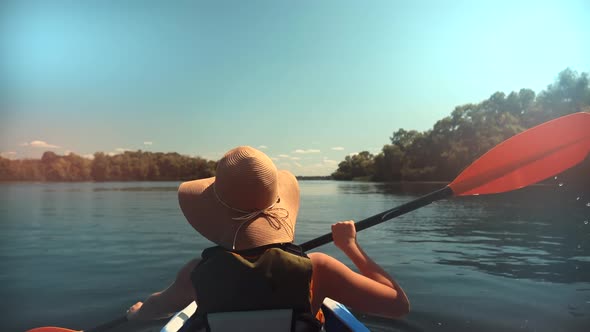 Girl In Kayak Summer Trip. Woman Exploring Calm River By Canoe On Holiday Vacation Weekend. alt