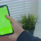 Man Using Vertical Smartphone with Green Screen. Close-up Shot of Man's Hands with Mobile Phone - VideoHive Item for Sale