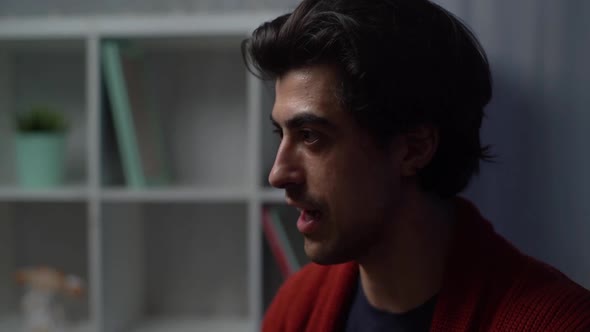 Close-up face of professional music teacher explains to student how to sing during lesson alt