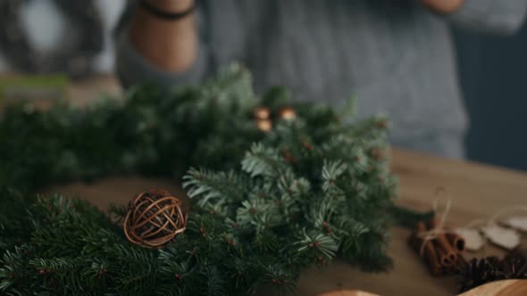 Adult man making Christmas decorations. Shot with RED helium camera in 8K alt