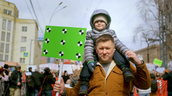 Demonstration of Single Father with Greenscreen Banner