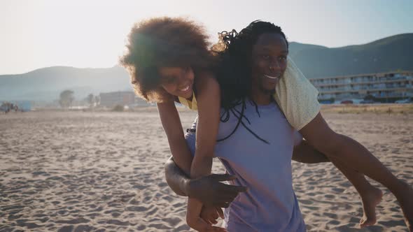 Happy family spending the day at the beach. alt