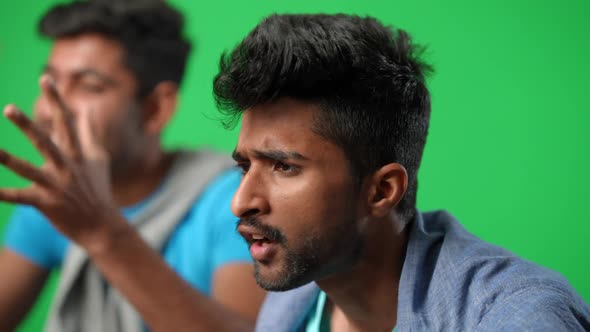 Side View Portrait of Emotional Anxious Middle Eastern Man Cheering with Friend Supporting Football alt