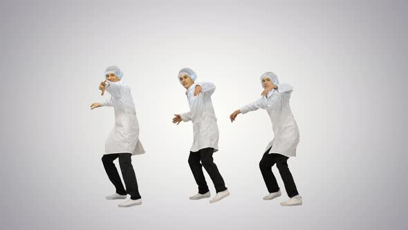 Three Male Doctors in White Robes and Protective Caps Doing Synch Dance Routine Looking at Camera on alt