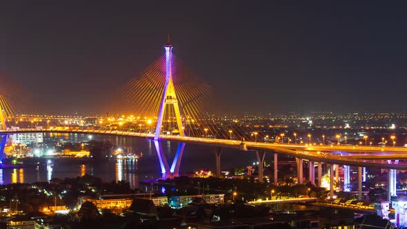 time lapse of Bhumibol suspension bridge cross over Chao Phraya River at night in Bangkok alt
