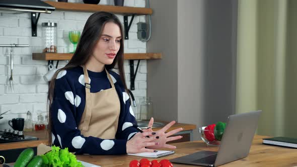 Smiling woman housewife greets tells study online video call webcam chat laptop alt