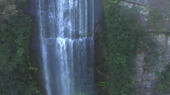 Aerial View Of Water Cascading Down A High Water Fall