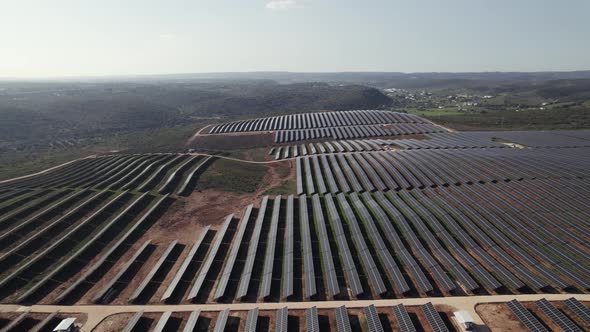 High panorama view endless Solar farm, rows of solar panels collecting sun, Portugal