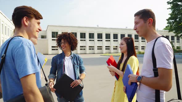 Students Meeting Together on Campus and Talking alt