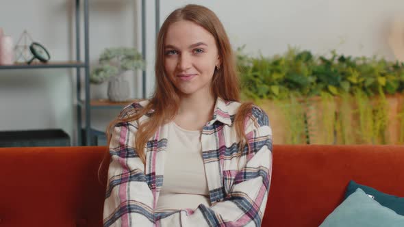 Portrait of Happy One Beautiful Teenager Student Girl Smiling Looking at Camera at Home on Sofa alt