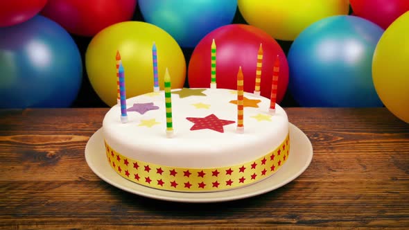 Birthday Cake On Table With Balloons By Rockfordmedia | Videohive