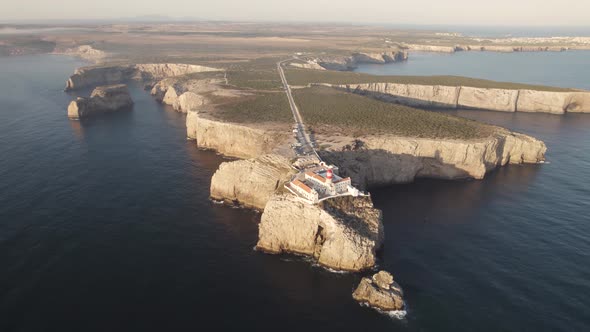 Sagres Point lighthouse in the cliff peninsula landscape, Portugal alt