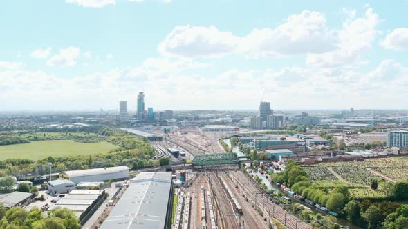 Drone shot over train leaving London near wormwood scrubs Acton alt