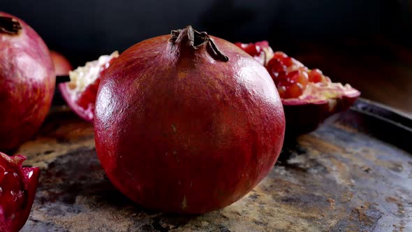 Whole Pomegranate Fruit Rotating on a Table