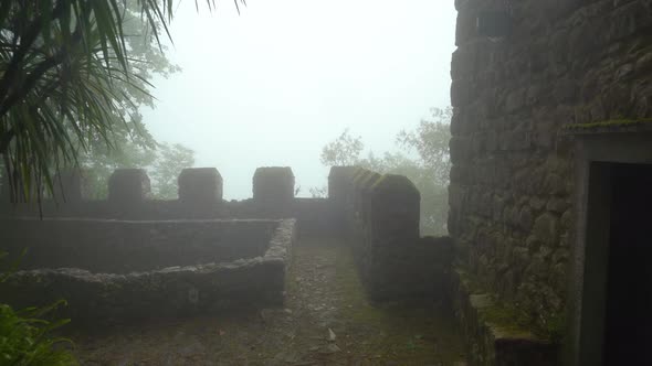 Defensive Guard Tower Wall of Moors Castle with Very Thick Fog and Mist alt