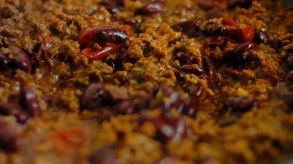 Pour the Lightly Canned Beanns Over the Chorizo Ingredients That are Frying alt