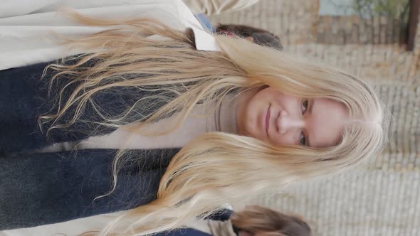 Vertical Video of Blonde Looking in Frame