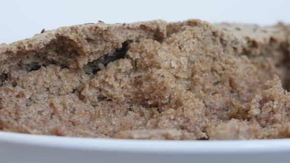 Slow pan  staple food served after baking 4K 2160p 30fps UltraHD footage - Dark brown tasty bread cr alt