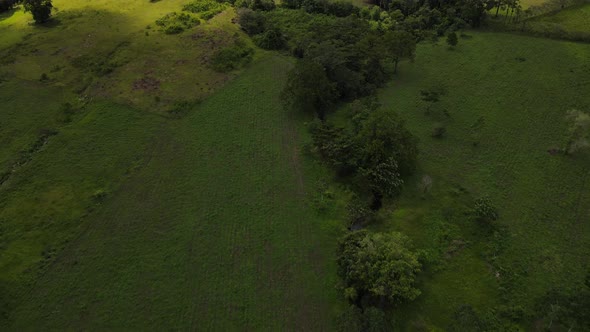 Cinematic aerial push-inement towards highly active Arenal volcano in Costa Rica. Gimbal up revealin alt