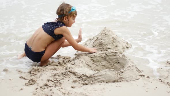 7Yearold Girl on the Beach Sand Castles