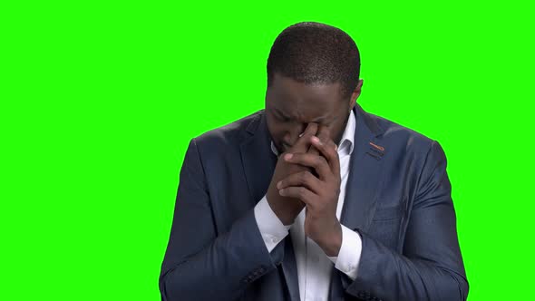 Unhappy Businessman Is Crying on Green Screen alt