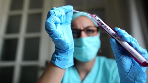 Doctor holding a coronavirus COVID-19 test tube