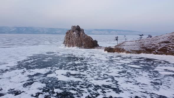 Baikal frozen lake, Olkhon island aerial. Clear ice and snow alt