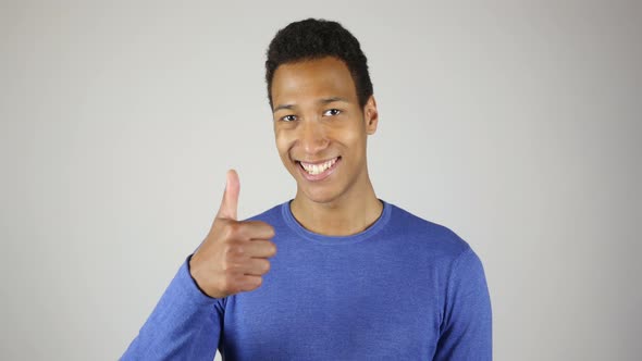 Thumbs Up By African Man White Background alt