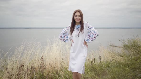 Fun Charming Carefree Girl Wearing Long Summer Fashion Dress Looking Confident at Camera Enjoying alt