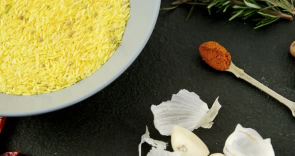 Rice in bowl with various spices ingredients 4k alt