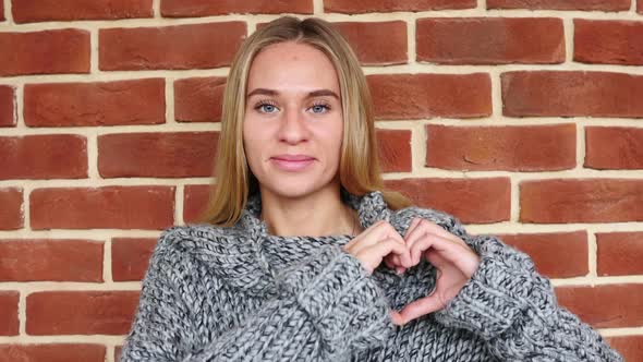 Heart Sign By Woman in Love in Loft Office alt