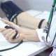 Female Doctor Measures A Patient's Blood Pressure - VideoHive Item for Sale