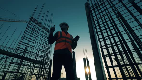 Construction Industry, Construction Project, Building Process During Sunset. Sunset Building Site alt