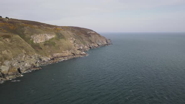 Scenic View Of Howth Head Surrounded By Irish Sea In Ireland. aerial drone, wide shot alt