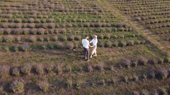 Young Couple Playing Around in the Lavender Fields