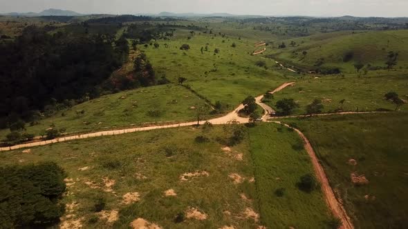 Aerial flying over a dry arid barren landscape on a hot day in the rural countryside during a draugh alt