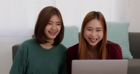 Happy Asian college student casual wear using computer working call video conference. alt