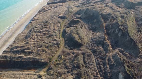 Aerial view drone flies near the sea. Wide view of the water. Beautiful blue sea. alt