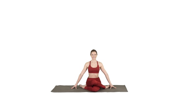 Young Attractive Woman Practicing Yoga Sitting in Gomukasana alt