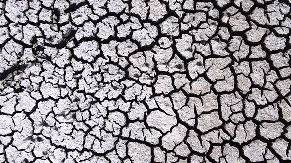 Vertical orientation video: Dried up lake. Cracked soil ground of dried lake or river alt