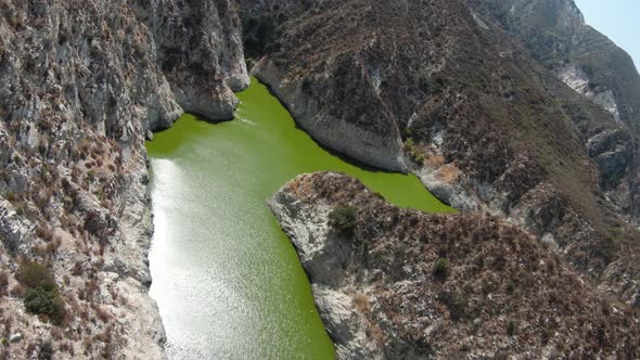 Aerial shot of a reservoir in the San Gabriel Mountains near Los Angles California alt
